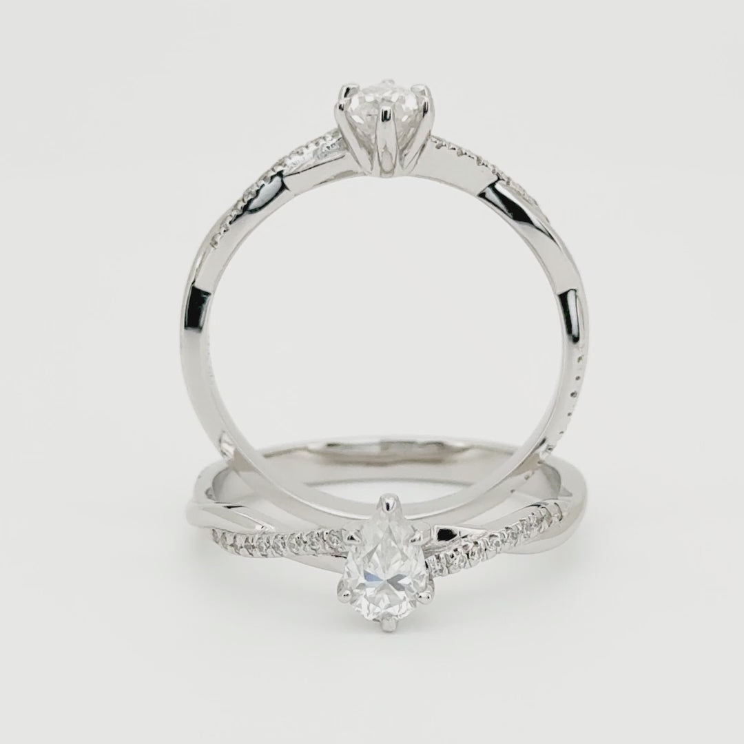 anillo de compromiso corte pera en estilo trenzado