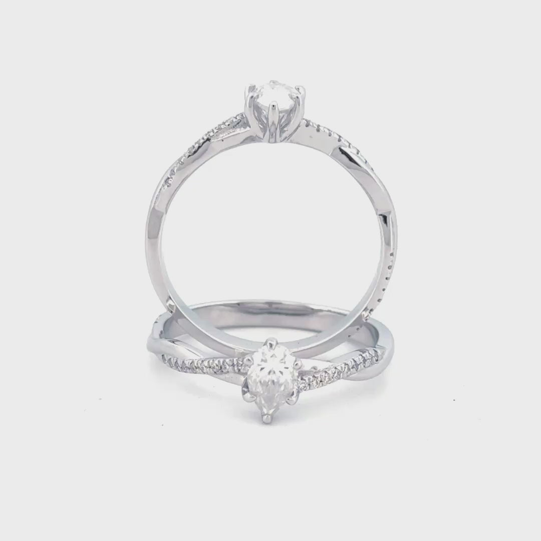 anillo de compromiso corte pera en estilo trenzado