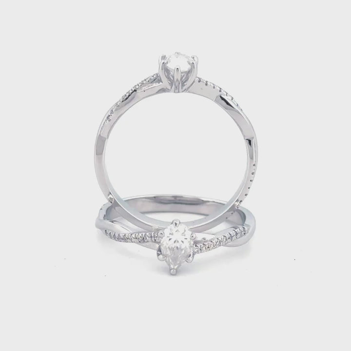 anillo de compromiso corte pera en estilo trenzado